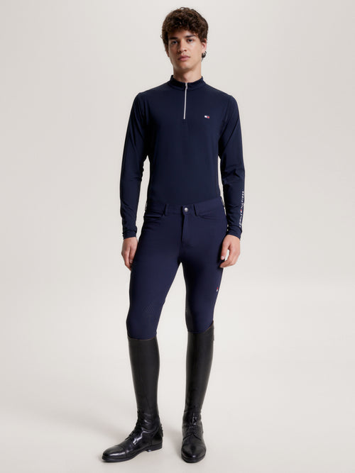 Tommy Hilfiger Equestrian® - Herren Trainingshirt Wellington Blau, langärmlige Trainingsoberteil besteht aus einem funktionellen, schnell trocknenden 4-Wege-Stretch-Material, das Sie während Ihrer Trainingseinheiten kühl und bequem hält Artikelnummer th13mlst711-004 erhältlich bei www.Hotti24.de