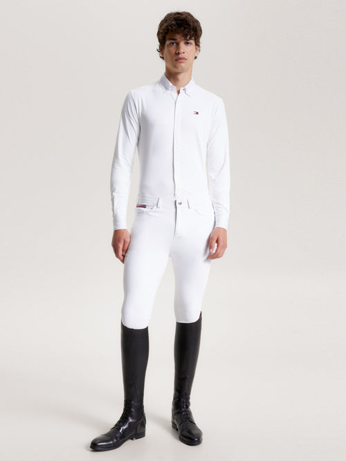 Tommy Hilfiger Equestrian® »Herren Turniershirt Amsterdam Weiß, klassisches Turniershirt mit dem gewissen Etwas und ohne Kompromisse. Mit Knopfleiste vorne, langen Ärmeln und atmungsaktivem 4-Wege-Stretch-Material, das Sie kühl hält, wenn es darauf ankommt Artikelnummer th13msls720-001 erhältlich bei www.Hotti24.de