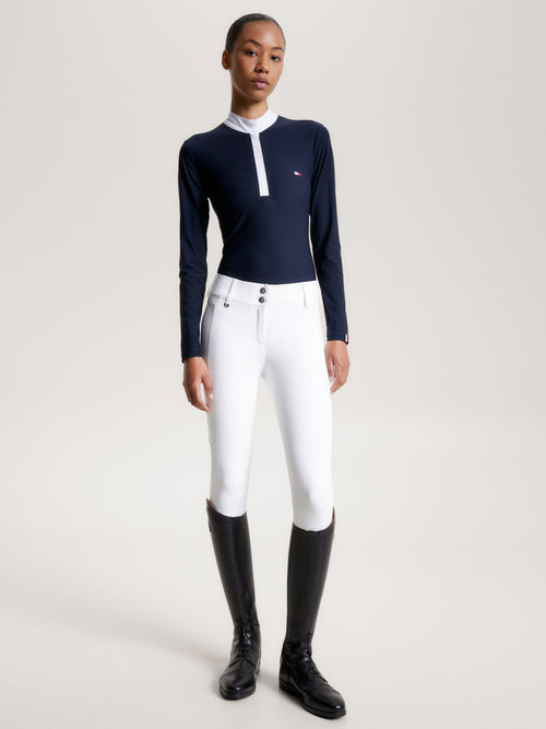 Tommy Hilfiger Equestrian® »Damen Turniershirt Chelsea Blau Langarm, aus einem 4-Wege-Stretchmaterial mit dezenter Textur, das Sie kühl und trocken hält, wenn es darauf ankommt, und einem schicken Stehkragen mit Druckknopfverschluss Artikelnummer th13wsls758-004 erhältlich bei www.Hotti24.de