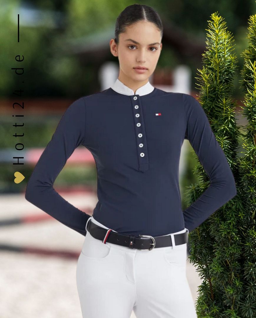 Tommy Hilfiger präsentiert das Damen-Turniershirt Performance in der Farbe Blau mit der Artikelnummer TH10001-004. Dieses Turniershirt kombiniert Stil und Leistung und ist ideal für Reiterinnen, die auf und abseits des Platzes glänzen möchten. Für weitere Informationen und die Möglichkeit zum Kauf besuchen Sie bitte die Website des Händlers www.Hotti24.de